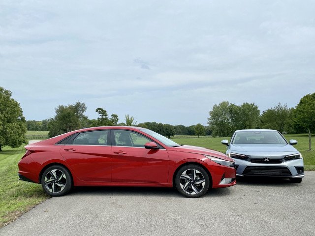 2022 Honda Civic Touring, blue, and 2021 Hyundai Elantra SEL, red 2022 Honda Civic Touring, blue, and 2021 Hyundai Elantra SEL, red