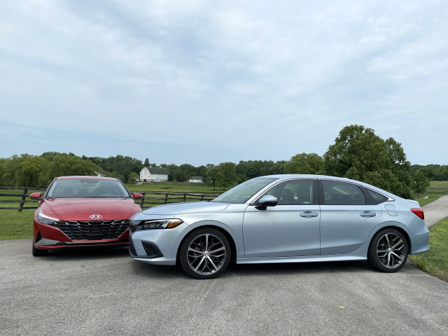 2022 Honda Civic Touring, blue, and 2021 Hyundai Elantra SEL, red 2022 Honda Civic Touring, blue, and 2021 Hyundai Elantra SEL, red
