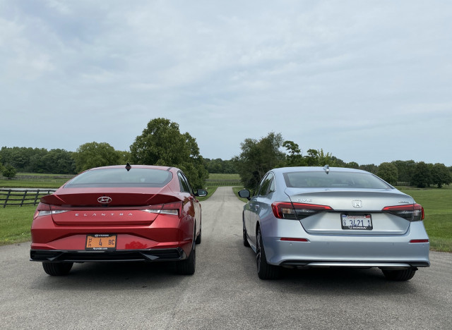 2022 Honda Civic Touring, blue, and 2021 Hyundai Elantra SEL, red 2022 Honda Civic Touring, blue, and 2021 Hyundai Elantra SEL, red