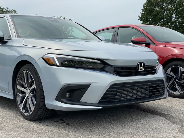 2022 Honda Civic Touring, blue, and 2021 Hyundai Elantra SEL, red 2022 Honda Civic Touring, blue, and 2021 Hyundai Elantra SEL, red