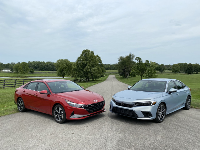 2022 Honda Civic Touring, blue, and 2021 Hyundai Elantra SEL, red 2022 Honda Civic Touring, blue, and 2021 Hyundai Elantra SEL, red