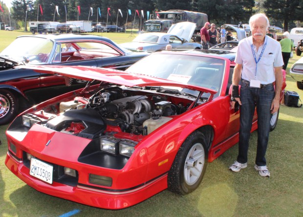 Norm Mills of Chico stands beside his 1988 Pontiac IROC...