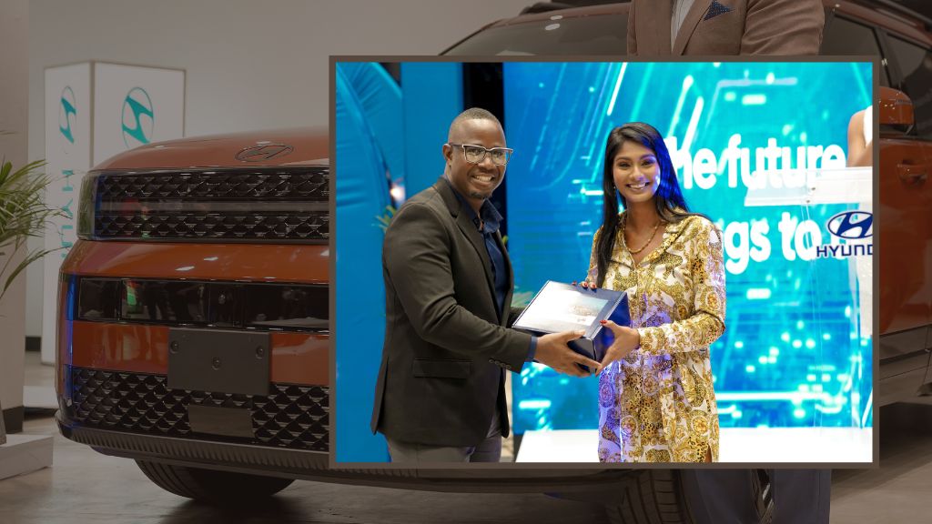 Magna Motors Dealership Limited Customer Relationship Manager Etmour Williams presented a spot prize to SportsMax Host, Journalist, Mariah Ramharack.