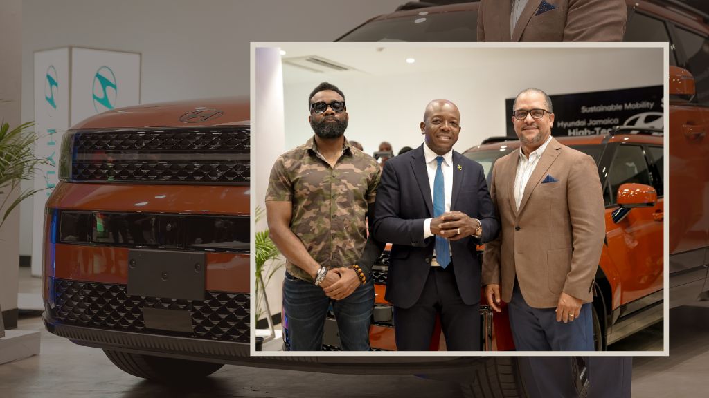 Minister of Labour and Social Security Pearnel Charles Jr (C), shared a photo op with Magna Motors Dealership Limited CEO, Erick Gutierrez (R), and his colleague.