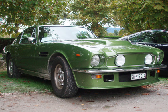 an olive green aston martin v8 vantage