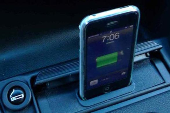 an iphone sitting in an ashtray slot