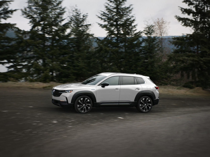 2025 mazda cx-50 parked along the side of a road