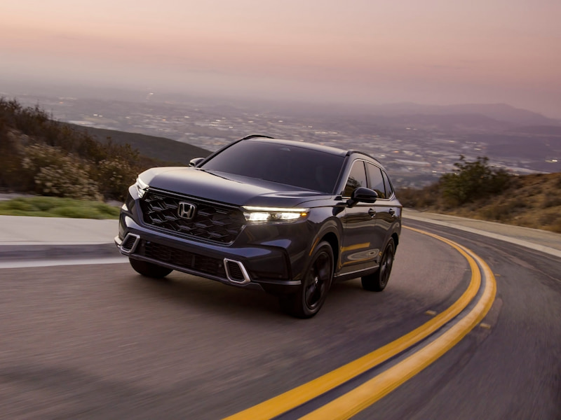 2025 honda cr-v one of the safest suvs driving around a corner